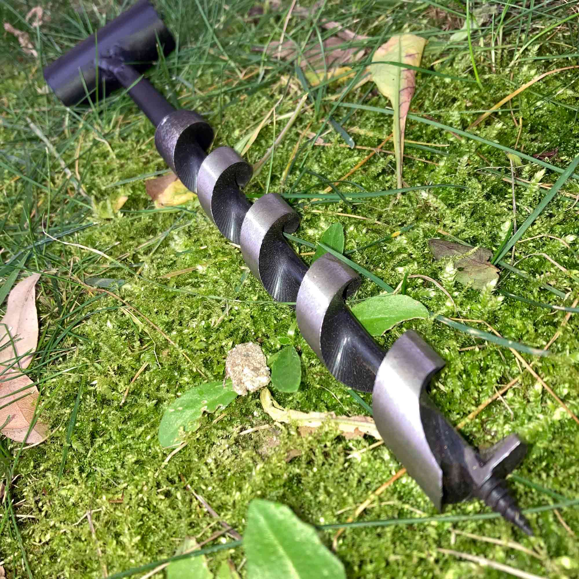 Hand clearance powered auger